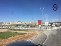 Seeing the security barrier beyond the check point, separating East Jerusalem from the West Bank.
